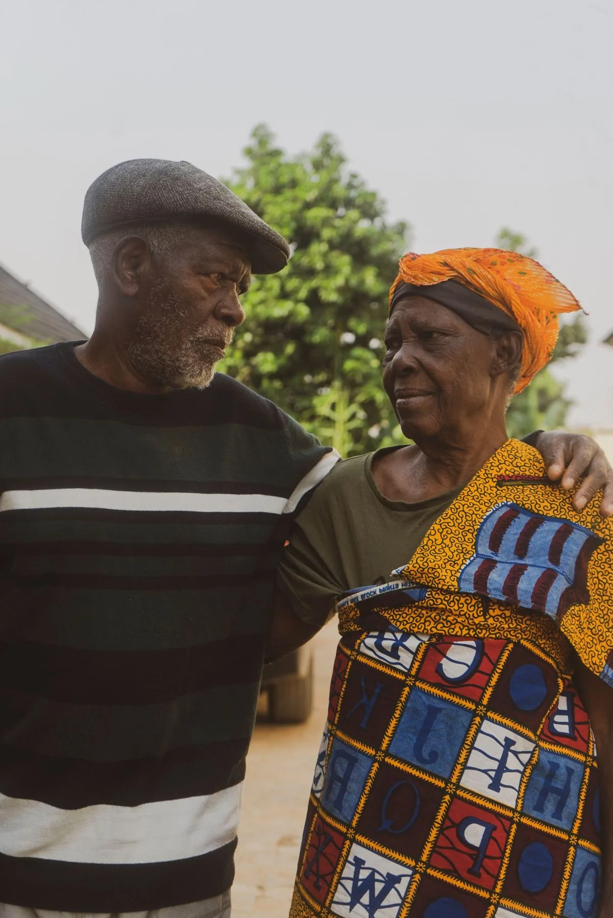 Older couple seated together outdoors