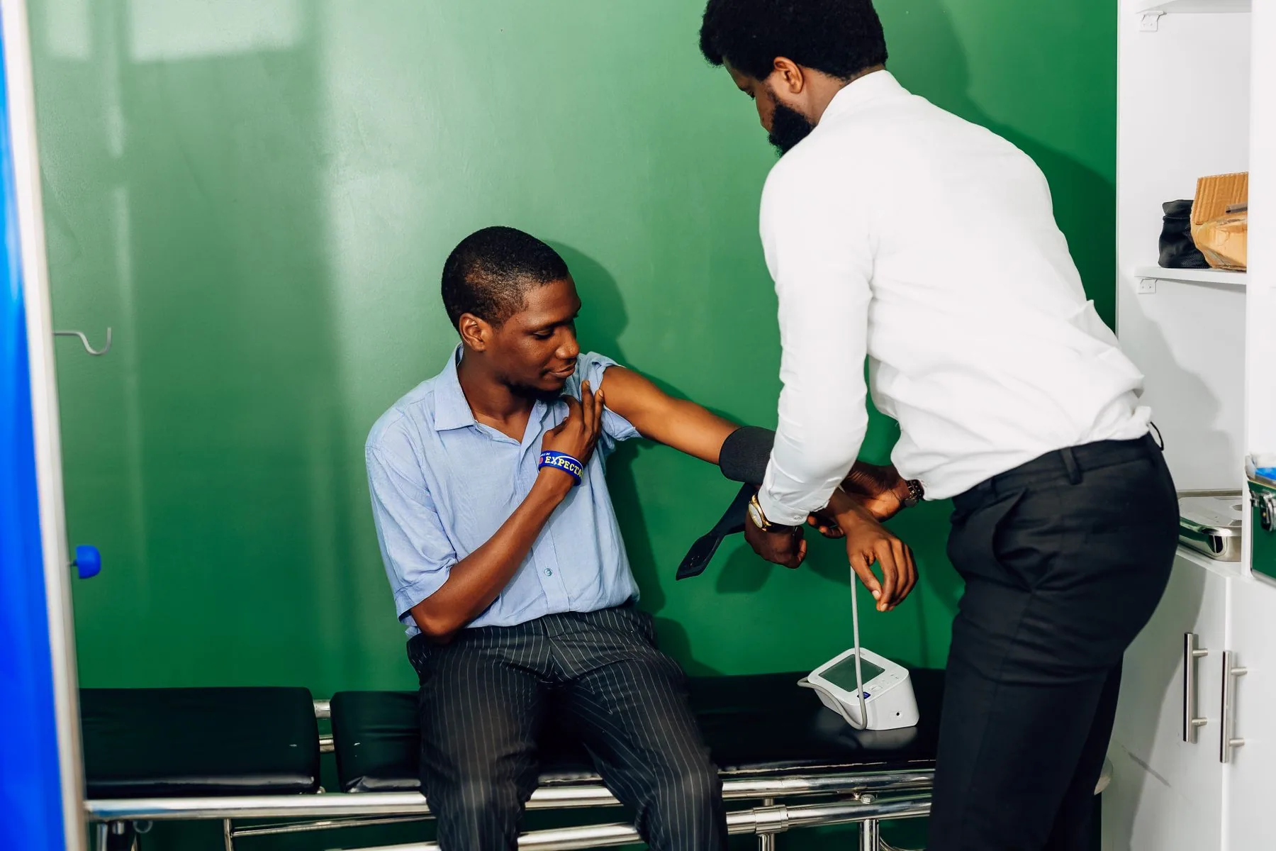 Healthcare professional checking a patient's blood pressure